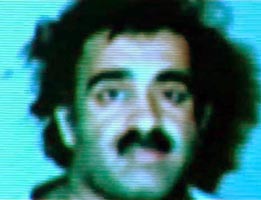 Khalid Shaikh Mohammed shortly after arrest. (Note: this picture is from a video presentation on prisoners the Pakistani government gave to BBC filmmakers. It has been adjusted to remove some blue tinge.)